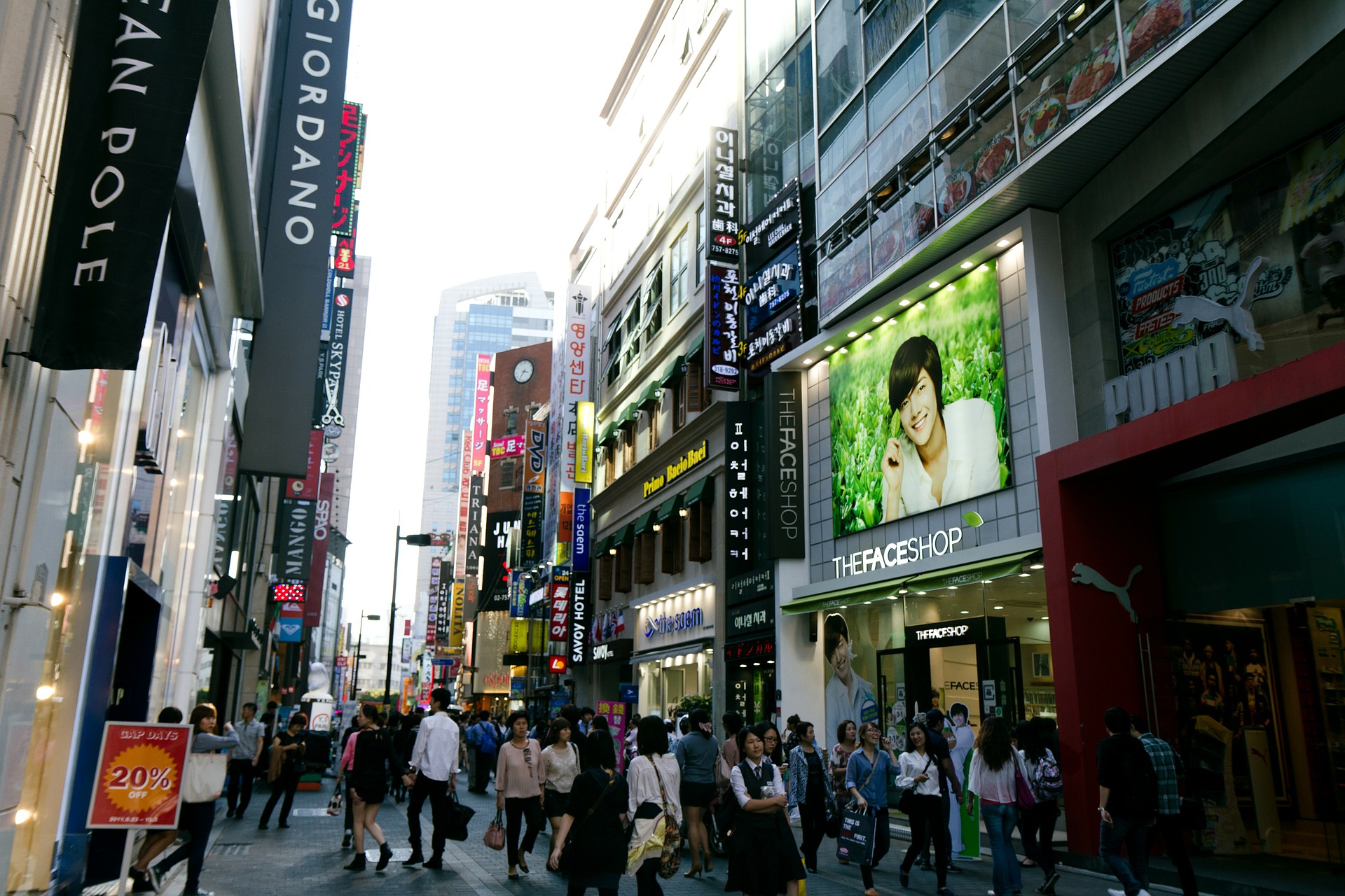 Typical street in Seoul South Korea with neon signs and busy foot traffic 